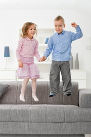 Kids jumping on sofa